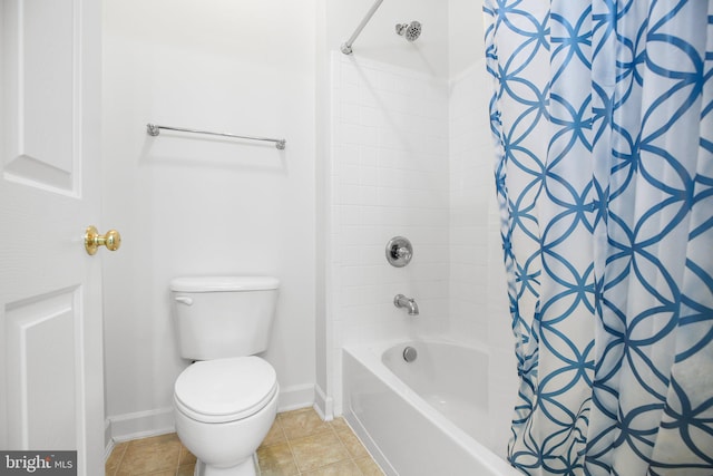 bathroom with shower / bath combination with curtain, tile patterned flooring, and toilet