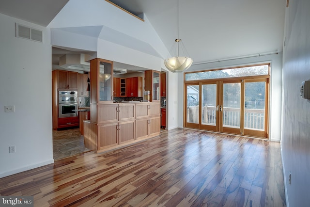 interior space featuring french doors, dark hardwood / wood-style floors, and lofted ceiling