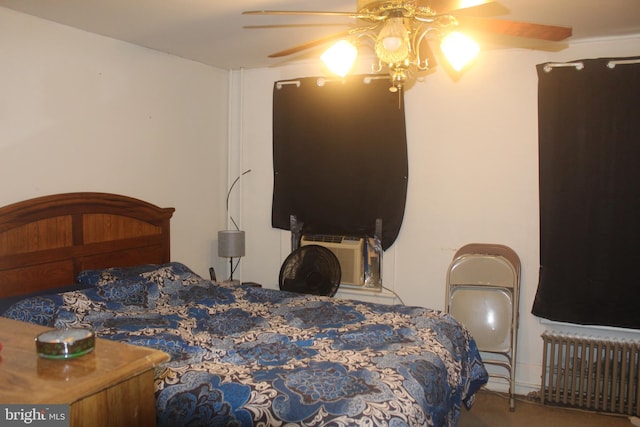 bedroom featuring radiator heating unit and ceiling fan