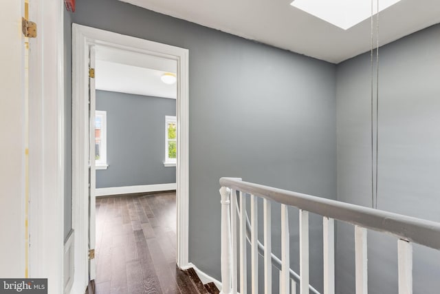 corridor with dark hardwood / wood-style floors