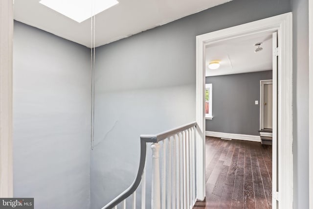 hallway featuring dark hardwood / wood-style flooring