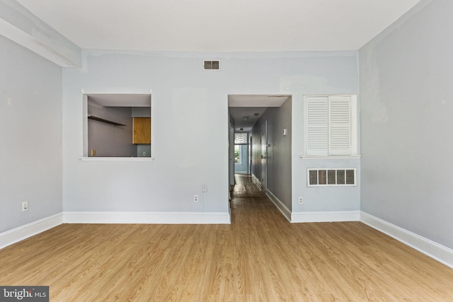 unfurnished room featuring hardwood / wood-style floors