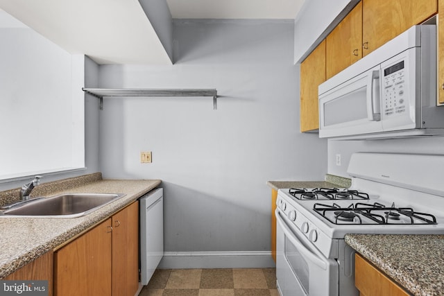 kitchen featuring sink and white appliances