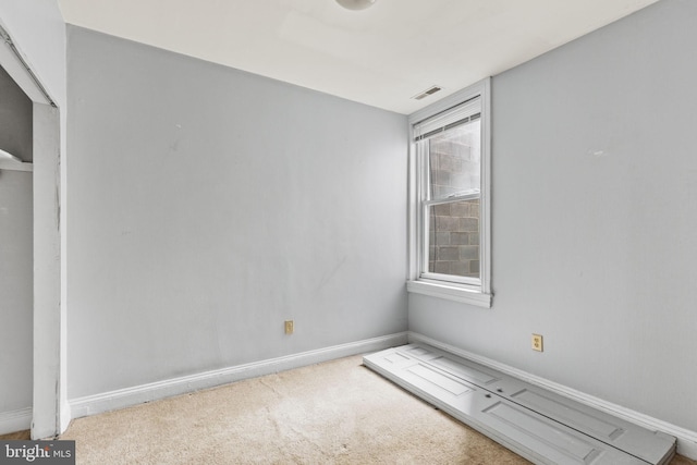 empty room featuring light colored carpet