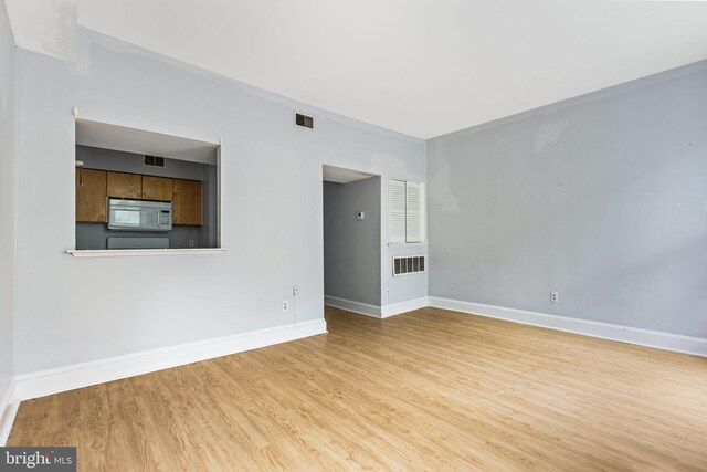 carpeted empty room featuring ceiling fan and plenty of natural light