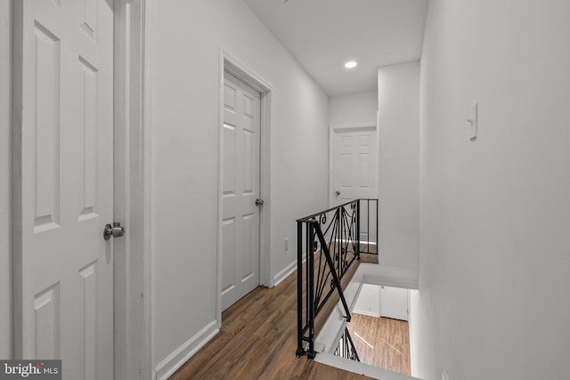 corridor with dark wood-type flooring