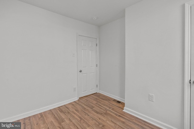 unfurnished room with light hardwood / wood-style flooring