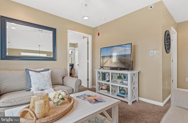 carpeted living room featuring ceiling fan