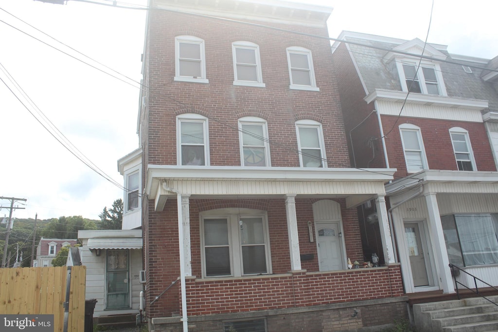 view of property with a porch