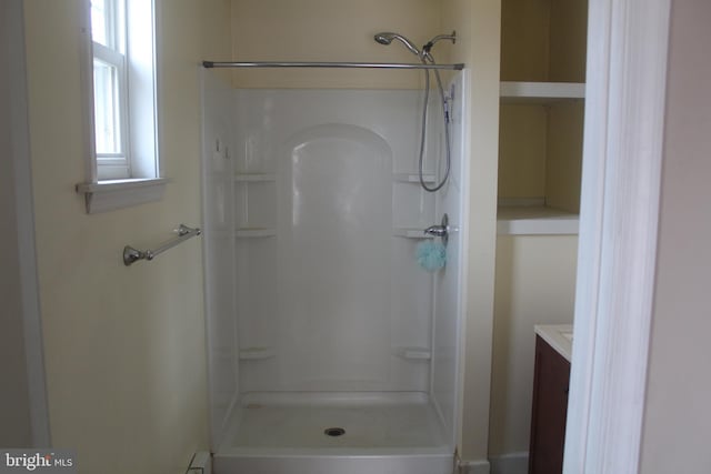 bathroom featuring vanity and walk in shower