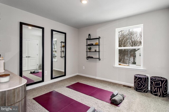 office area with carpet floors and built in desk