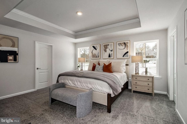 carpeted bedroom featuring crown molding, a raised ceiling, and baseboards