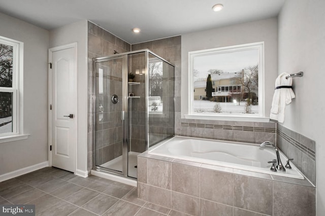 bathroom with tile patterned floors and plus walk in shower