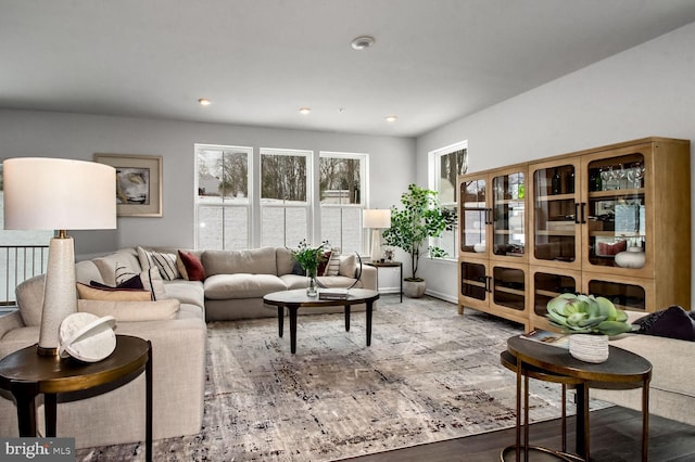 living area featuring plenty of natural light, recessed lighting, and wood finished floors