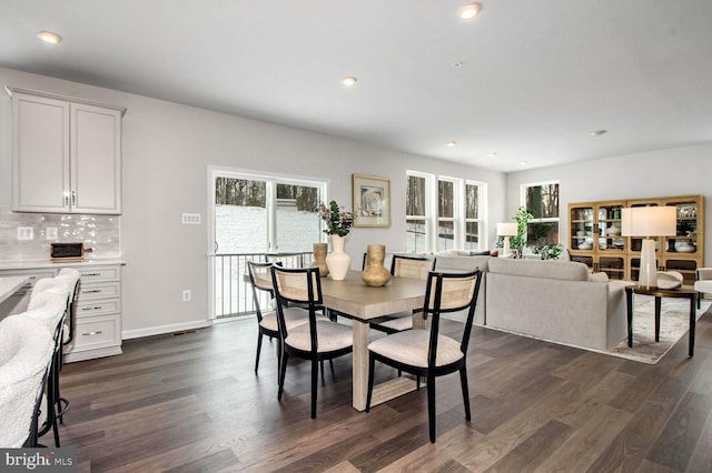 dining room featuring recessed lighting, dark wood-style floors, and baseboards