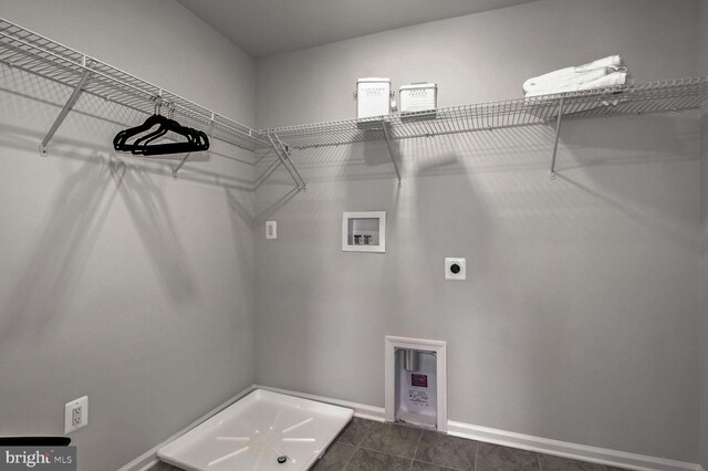 carpeted bedroom featuring ceiling fan and a raised ceiling