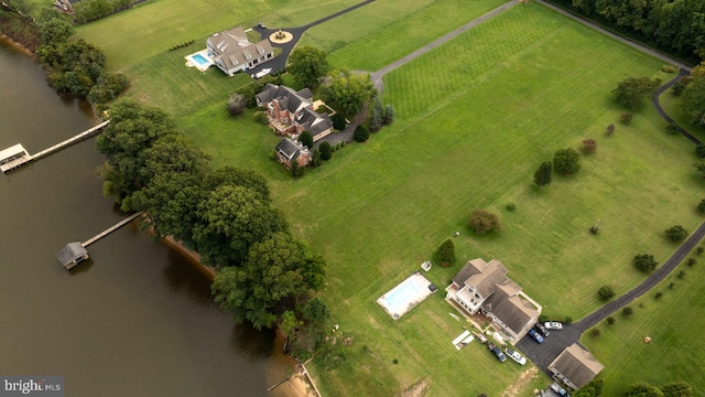 drone / aerial view featuring a water view and a rural view