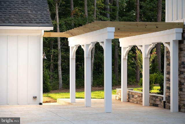 view of property's community featuring a pergola and a patio