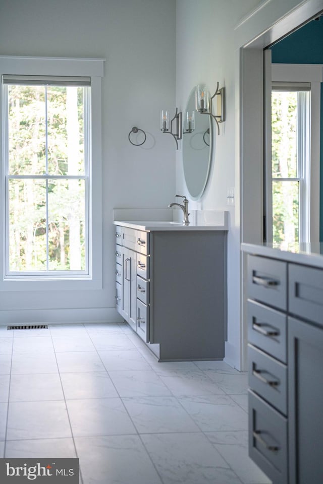 bathroom featuring vanity and plenty of natural light