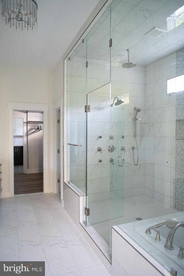 bathroom with a shower with shower door