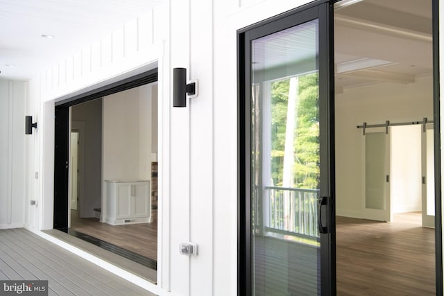 doorway featuring hardwood / wood-style floors and a barn door