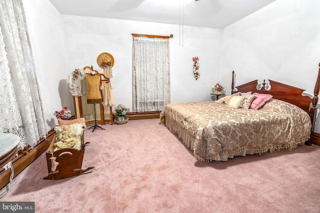 carpeted bedroom with a ceiling fan