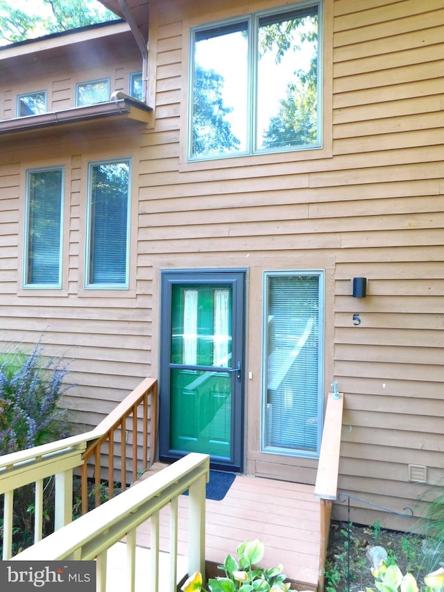 doorway to property with a wooden deck