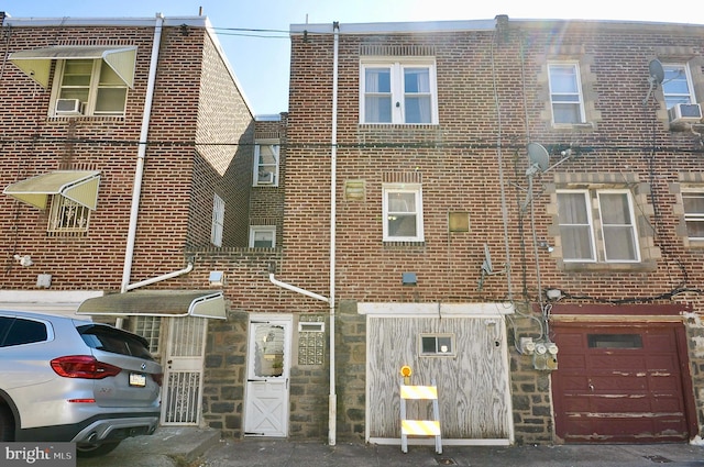 multi unit property with stone siding and brick siding