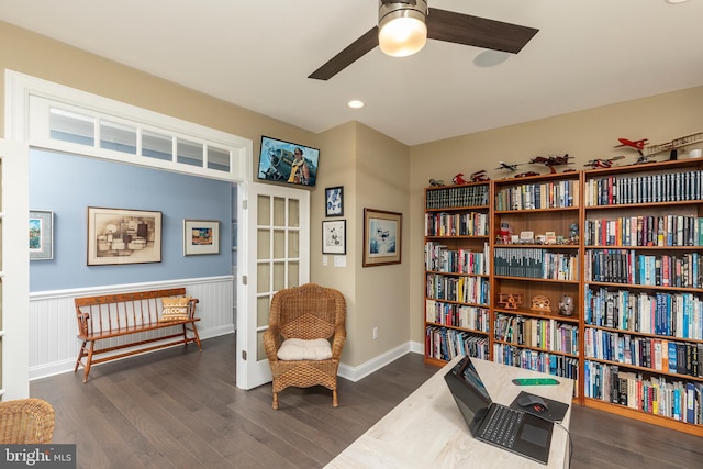 sitting room with dark hardwood / wood-style flooring and ceiling fan