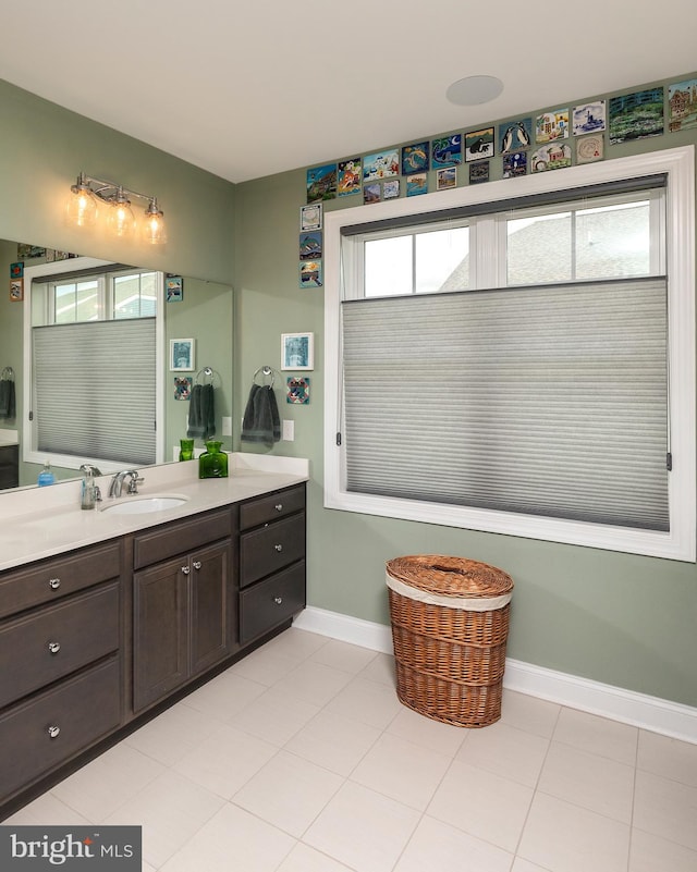 bathroom with tile patterned flooring, plenty of natural light, and vanity