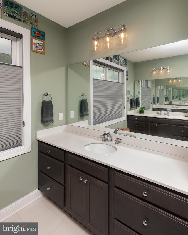 bathroom with tile patterned flooring and vanity