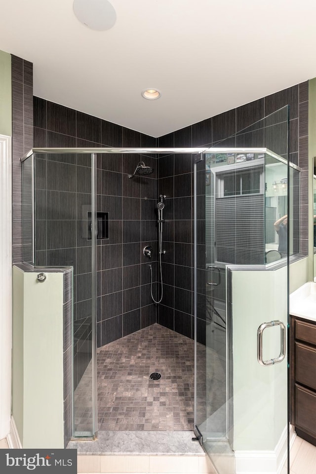 bathroom with vanity, tile patterned floors, and an enclosed shower