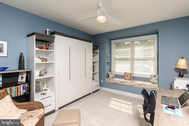 carpeted office space with ceiling fan