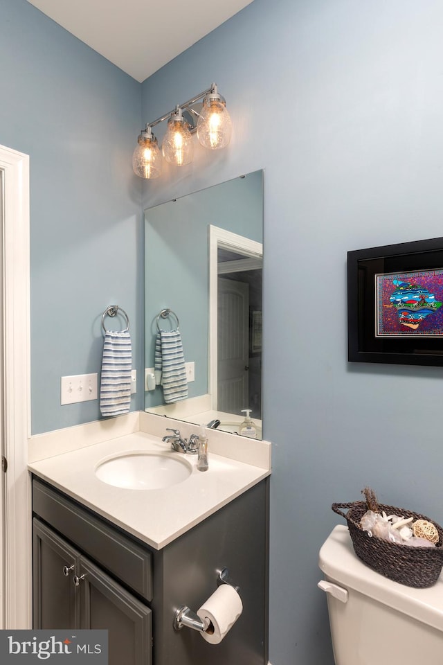 bathroom with vanity and toilet