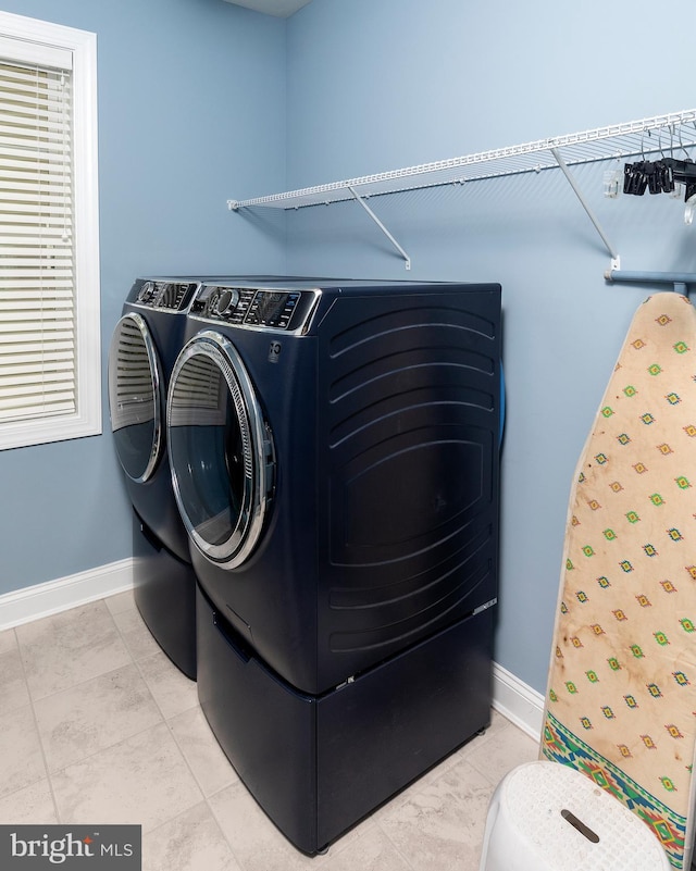 laundry room featuring separate washer and dryer