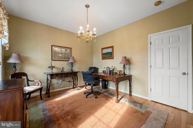 office area featuring a chandelier and hardwood / wood-style floors