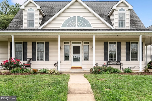 view of front of house with a front yard and a porch