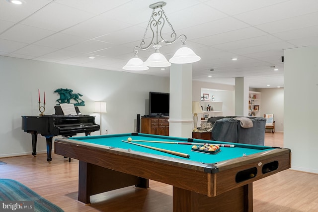 rec room with light hardwood / wood-style flooring, a drop ceiling, and billiards