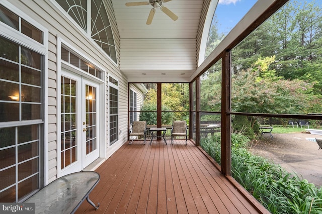 wooden terrace featuring ceiling fan and french doors