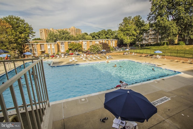 view of swimming pool with a patio