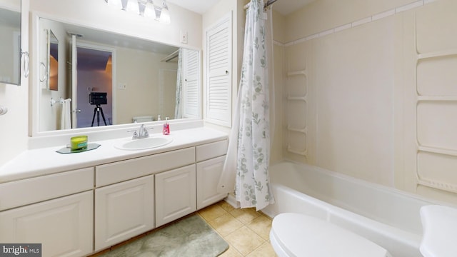 full bathroom featuring tile patterned flooring, vanity, shower / bath combination with curtain, and toilet