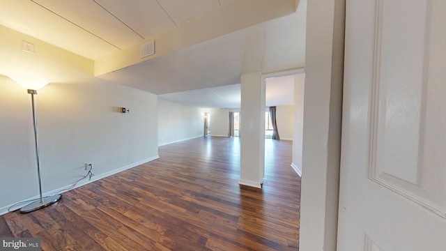 unfurnished room with dark hardwood / wood-style floors