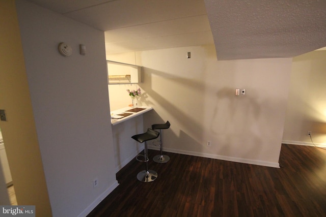 interior space with hardwood / wood-style floors and a textured ceiling