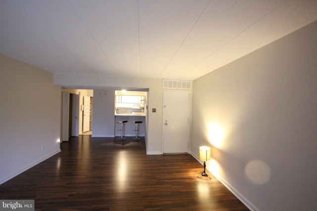 unfurnished room featuring dark hardwood / wood-style floors