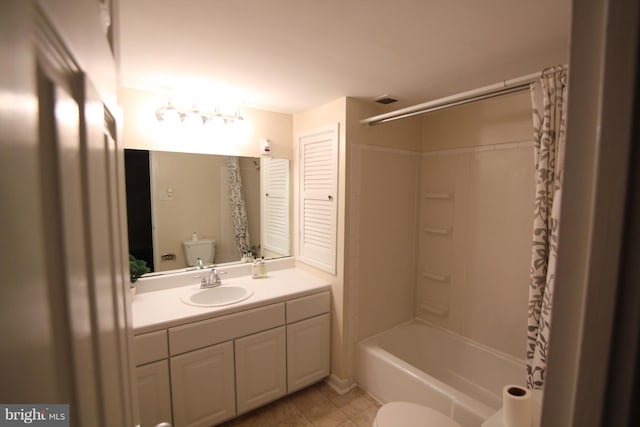 full bathroom featuring vanity, toilet, tub / shower combination, and tile patterned flooring