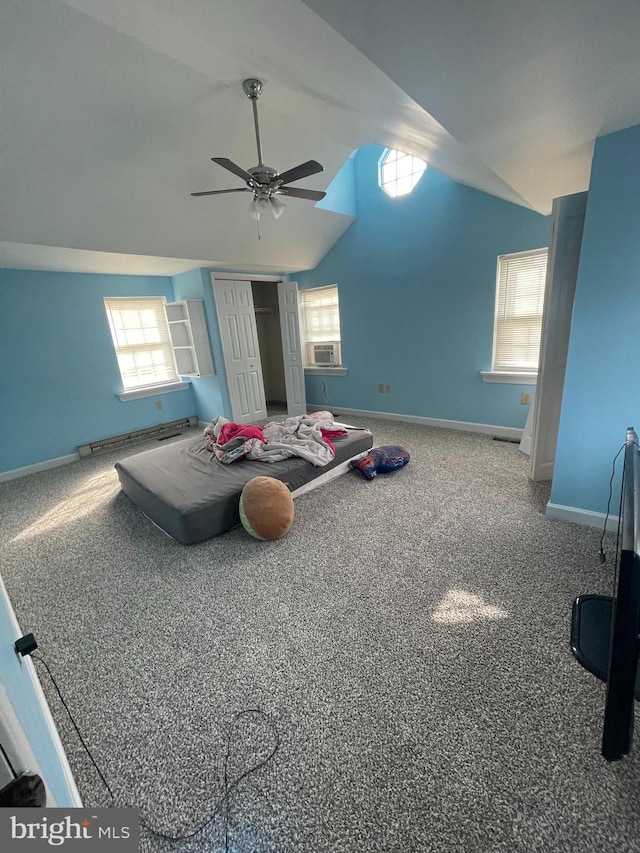 interior space featuring ceiling fan, vaulted ceiling, cooling unit, and carpet flooring