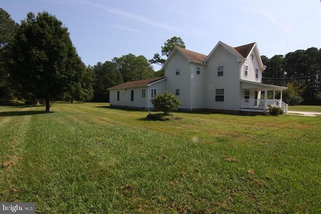 view of property exterior with a lawn