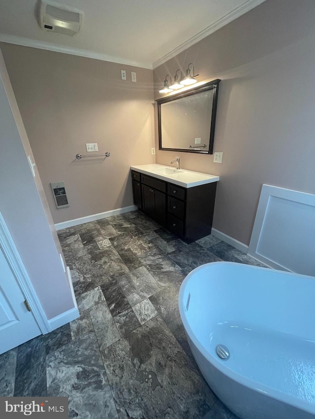 bathroom with ornamental molding, heating unit, a tub to relax in, and vanity