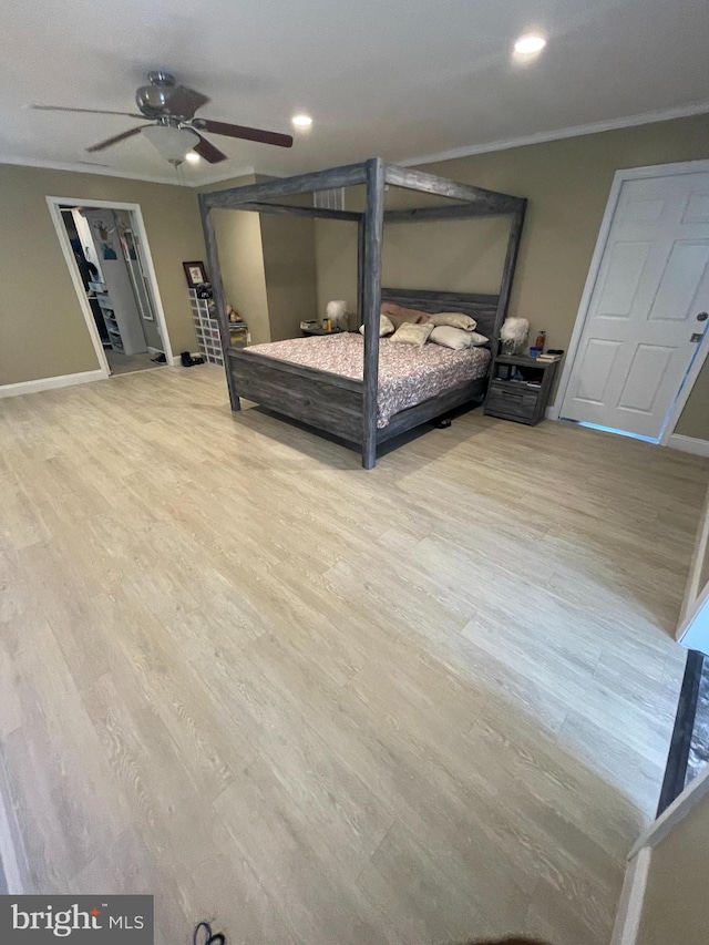 unfurnished bedroom with ceiling fan, hardwood / wood-style flooring, and crown molding