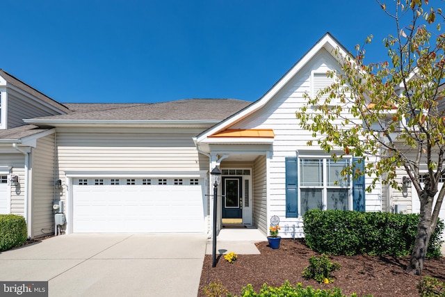 view of front of property with a garage